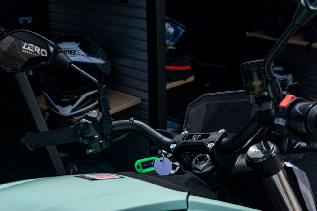 A close-up view of a mint-green 2021 Zero SR/F Premium's handlebars and TFT display