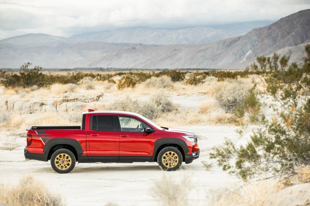Red Honda Ridgeline parked in the desert. This is the same model and color as we had in our 2021 Honda Ridgeline review