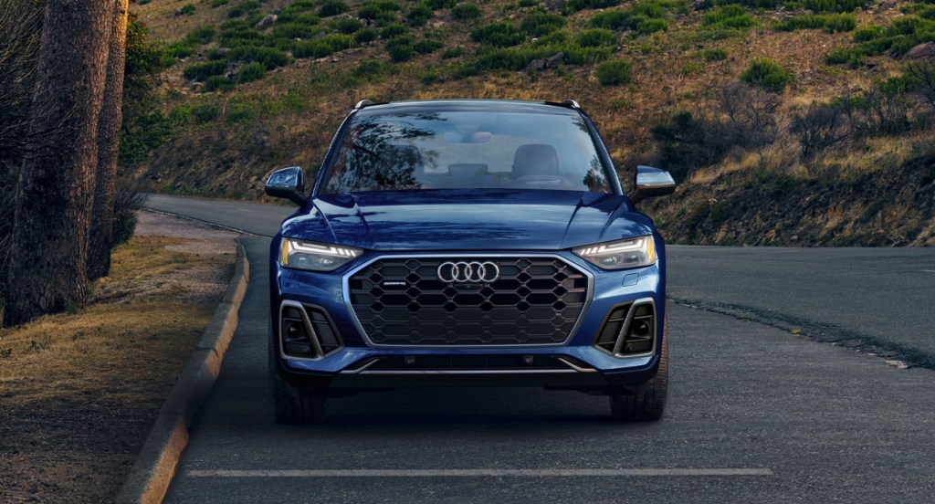 A blue 2022 Audi Q5 is parked on the road.