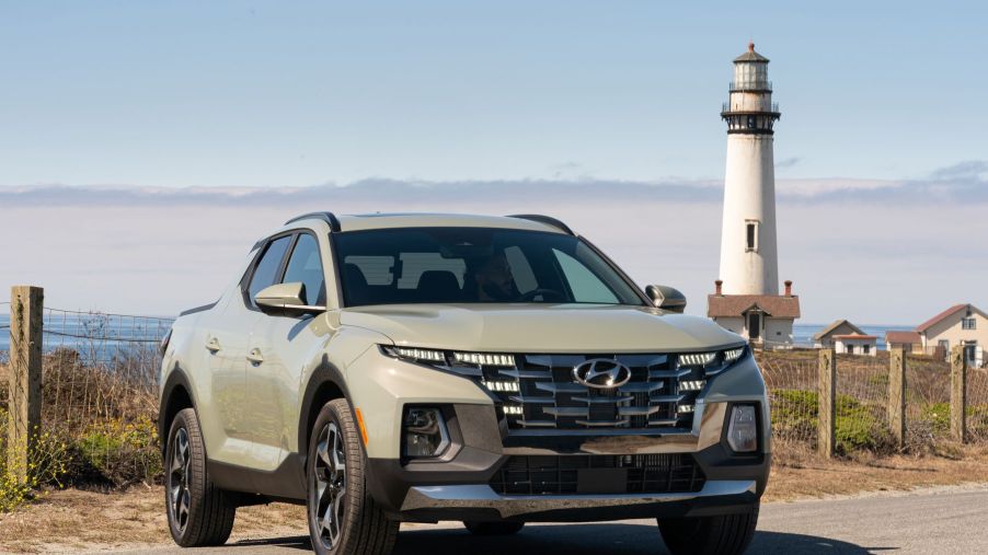 2022 Hyundai Santa Cruz sport adventure vehicle parked near a lighthouse