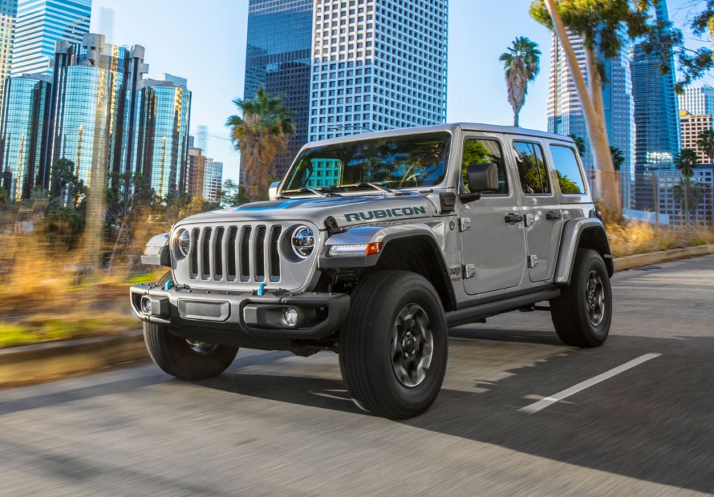 The 2021 Jeep® Wrangler Rubicon 4xe driving in the city