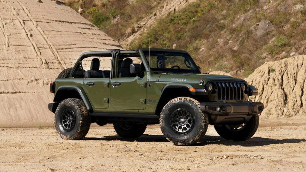 A green 2022 Jeep Wrangler Willys Xtreme Recon parked in the desert