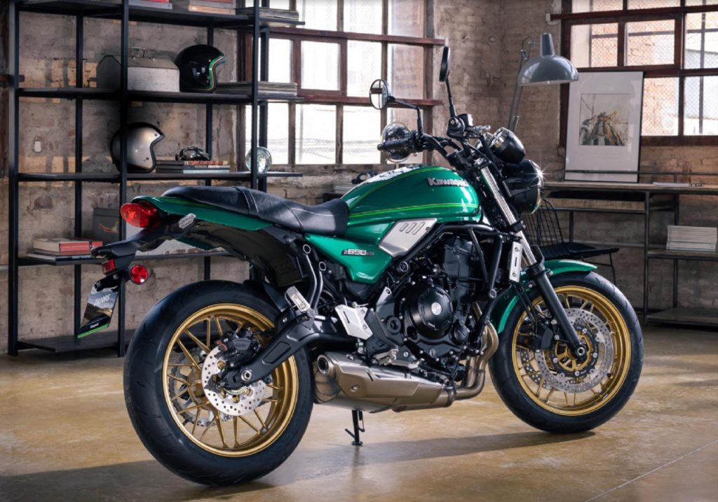 The side 3/4 view of a green-black-and-silver 2022 Kawasaki Z650RS with gold wheels