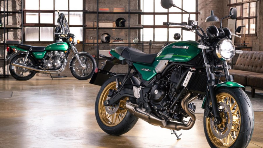 A green-and-black 2022 Kawasaki Z650RS with a green 1976 Kawasaki Z650 in the background