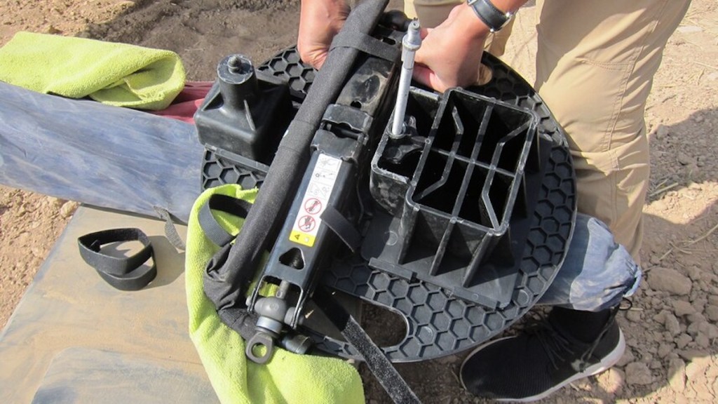 small plastic circle holds the tool changing kit and acts a base for the jack