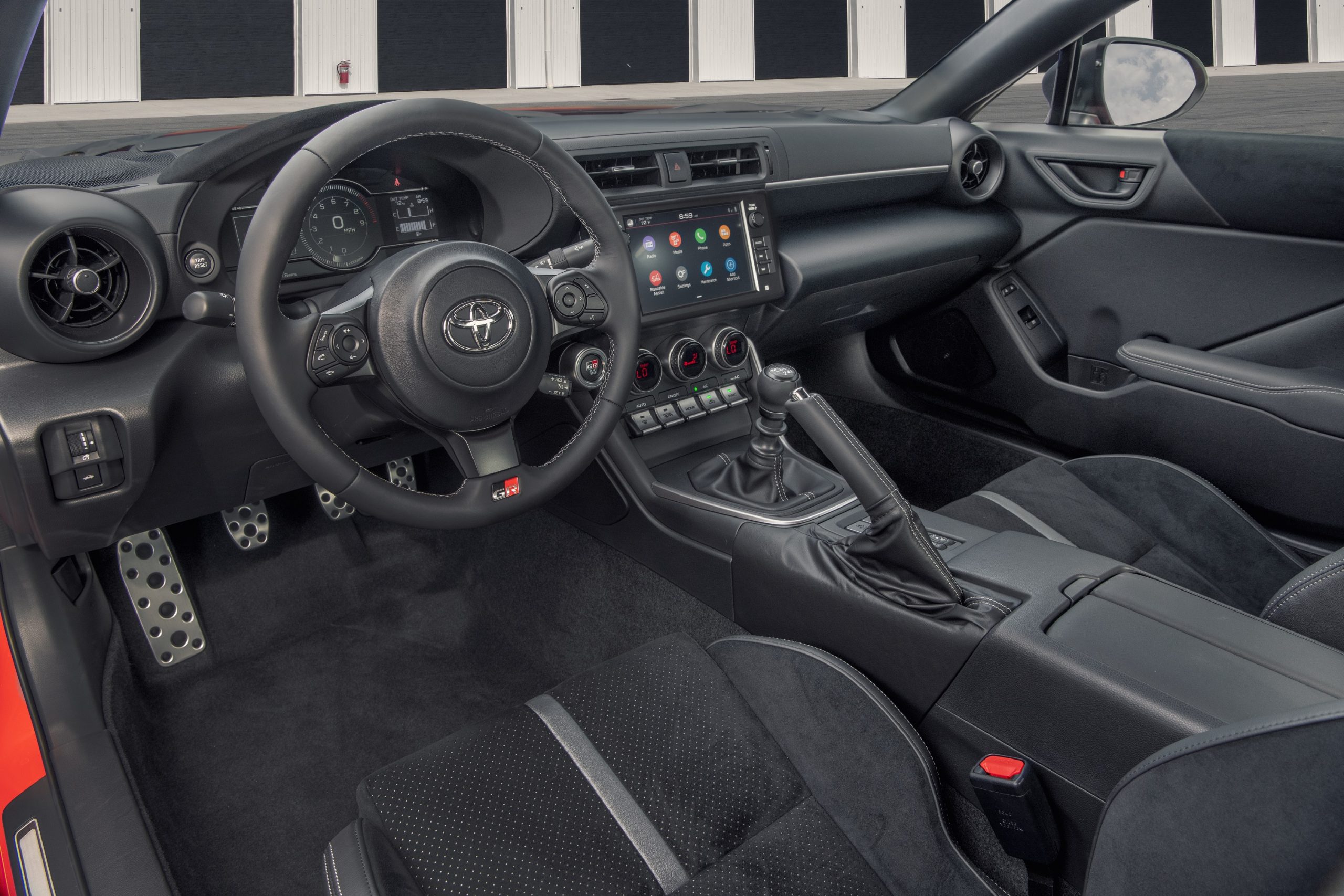 The alcantara clad interior of the Toyota GR 86 Premium shot from the driver's side window