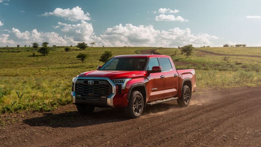 A red 2022 Toyota Tundra on a dirt road