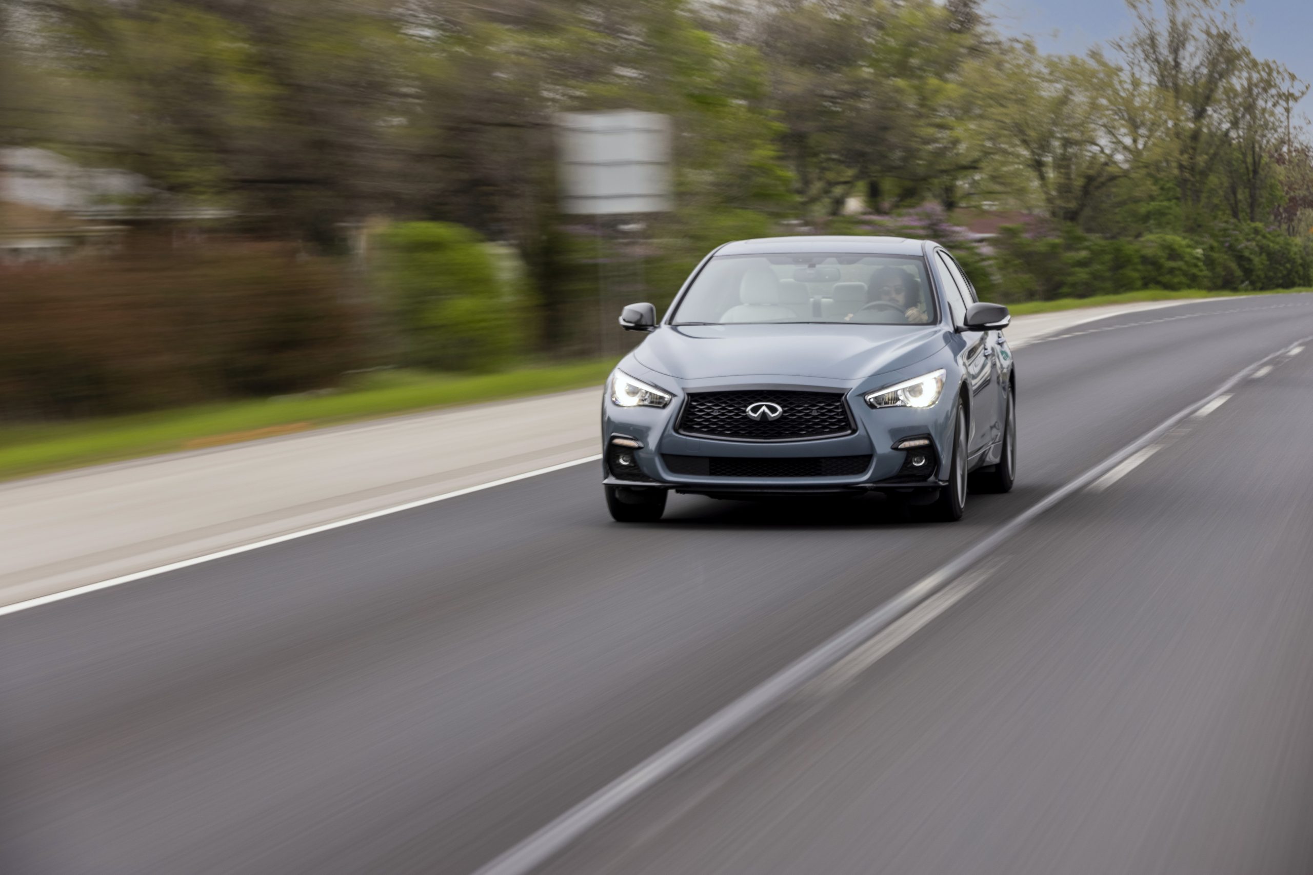 The 2022 Infiniti Q50 driving down the road
