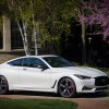 The 2022 Infiniti Q60 parked near a home