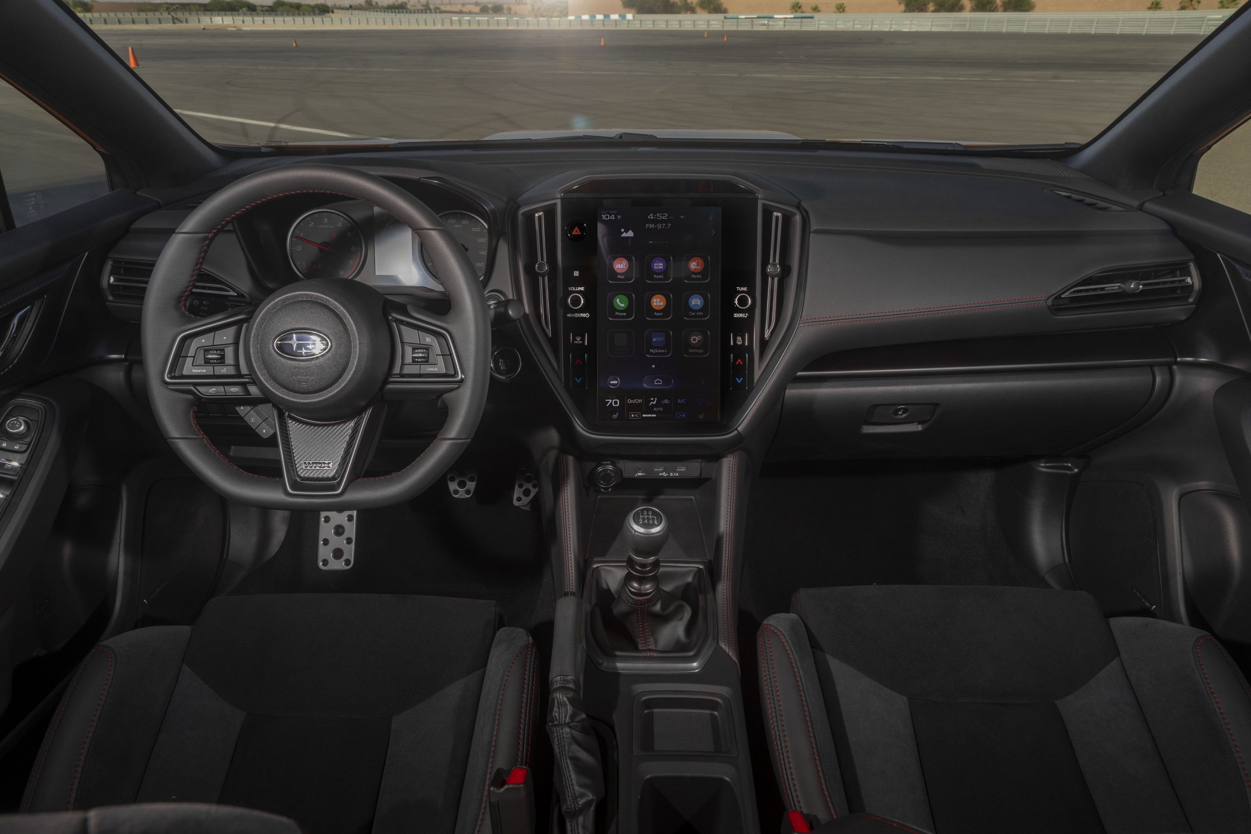 The black interior of the 2022 Subaru WRX with manual transmission, shot from the center rear seat
