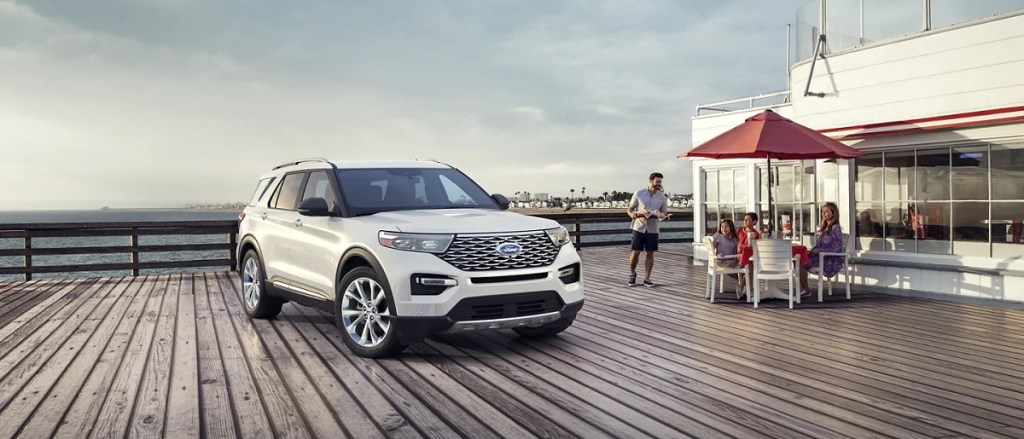 A white 2021 Ford Explorer parked on a boardwalk.