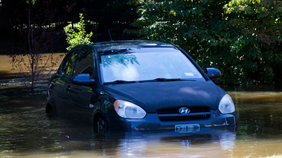 A car sits in a flooded parking spot after a night of high winds and rain from the remnants of Hurricane Ida