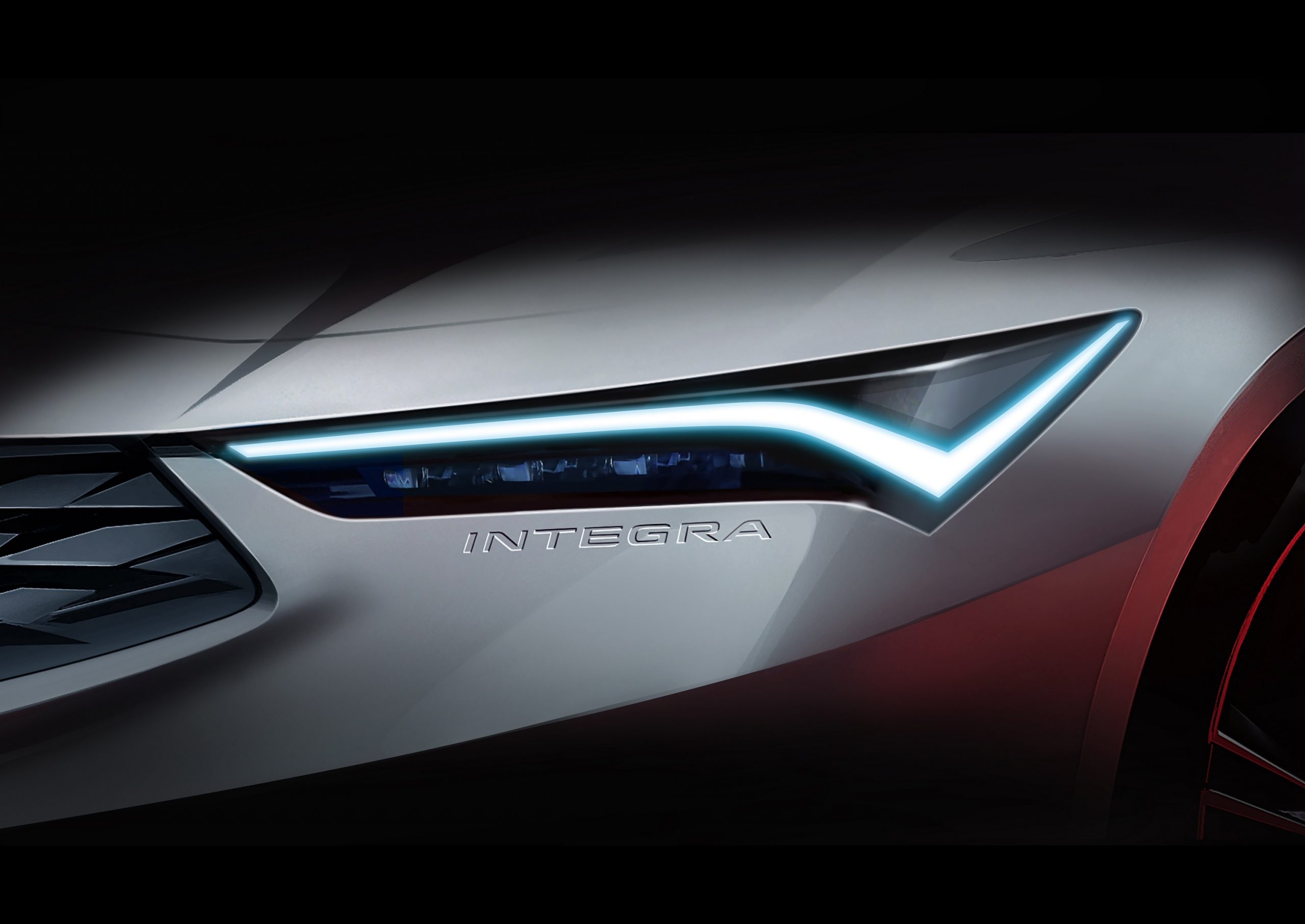 The headlight of the white 2022 Acura Integra