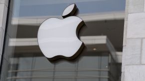 The Apple logo is seen at the entrance of an Apple store in Washington, DC