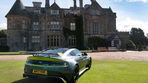 The 2017 Aston Martin Vantage GT8 parked in front of a mansion