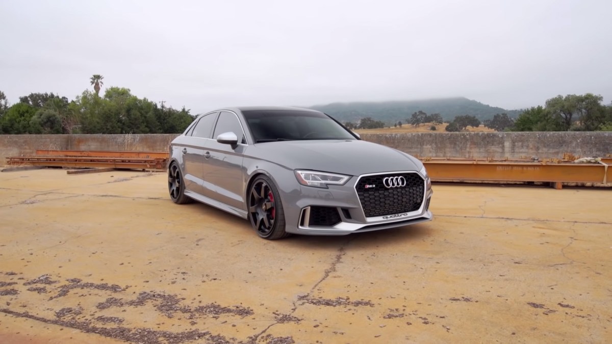 A grey 2017 Audi RS3 with black wheels preparing for a drag race