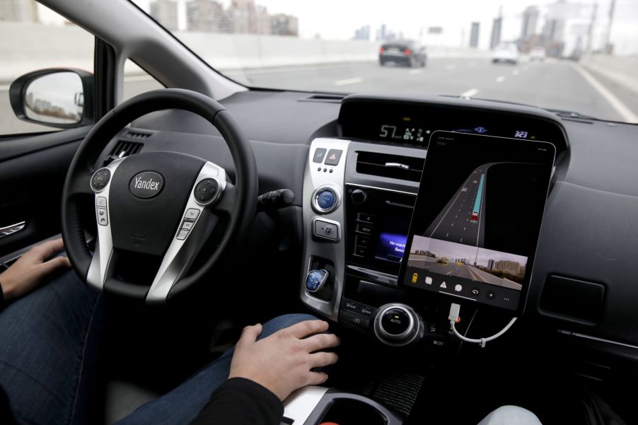 A car driving down the road illustrating the levels of automation from Yandex.