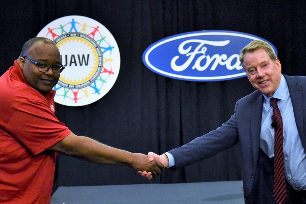 UAW International Vice President Rory Gamble (left) shaking hands with Bill Ford executive chairman of Ford Motor Company (right). Ford is in discussions with the UAW regarding tracking the vaccination of hourly employees