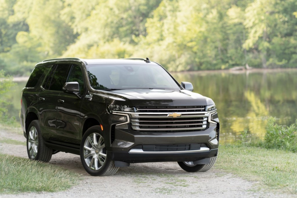 Black 2021 Chevrolet Tahoe parked next to a lake