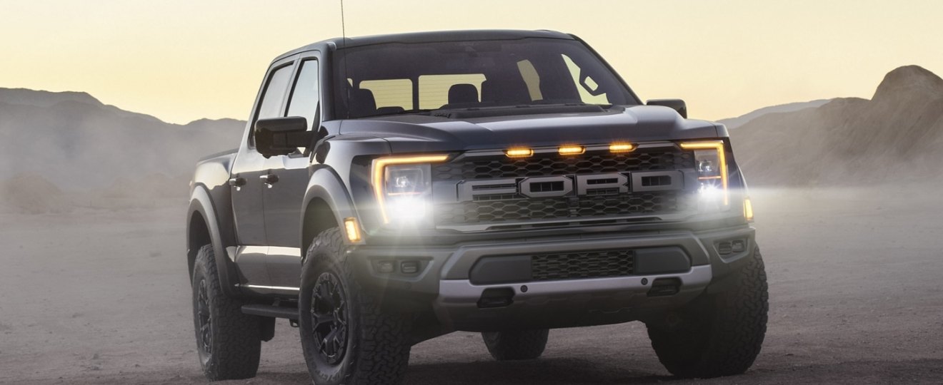 Black 2021 Ford F-150 Raptor with mountains in the background