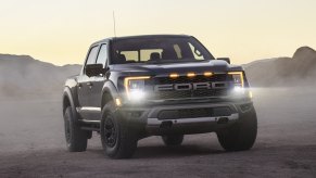 Black 2021 Ford F-150 Raptor with mountains in the background