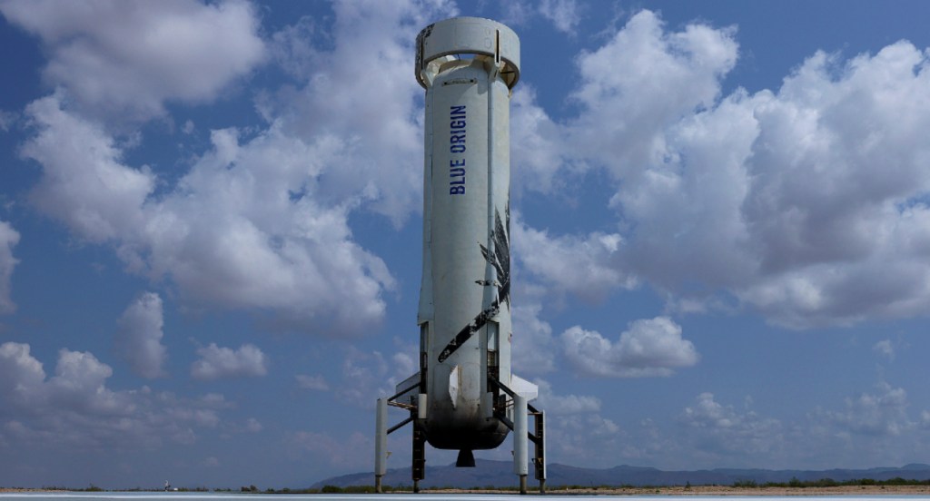 The booster for Blue Origin’s New Shepard sits on the landing pad.
