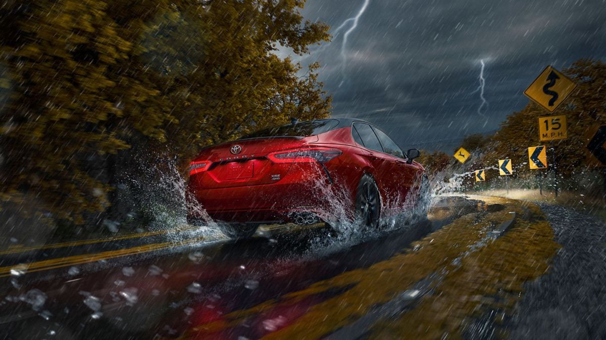 Toyota Camry driving through the rain
