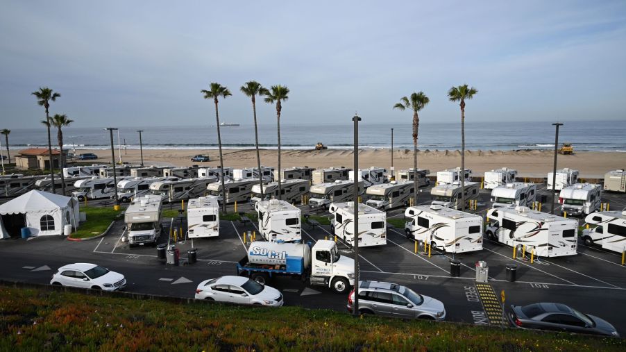 Camper RV park in front of a beach.