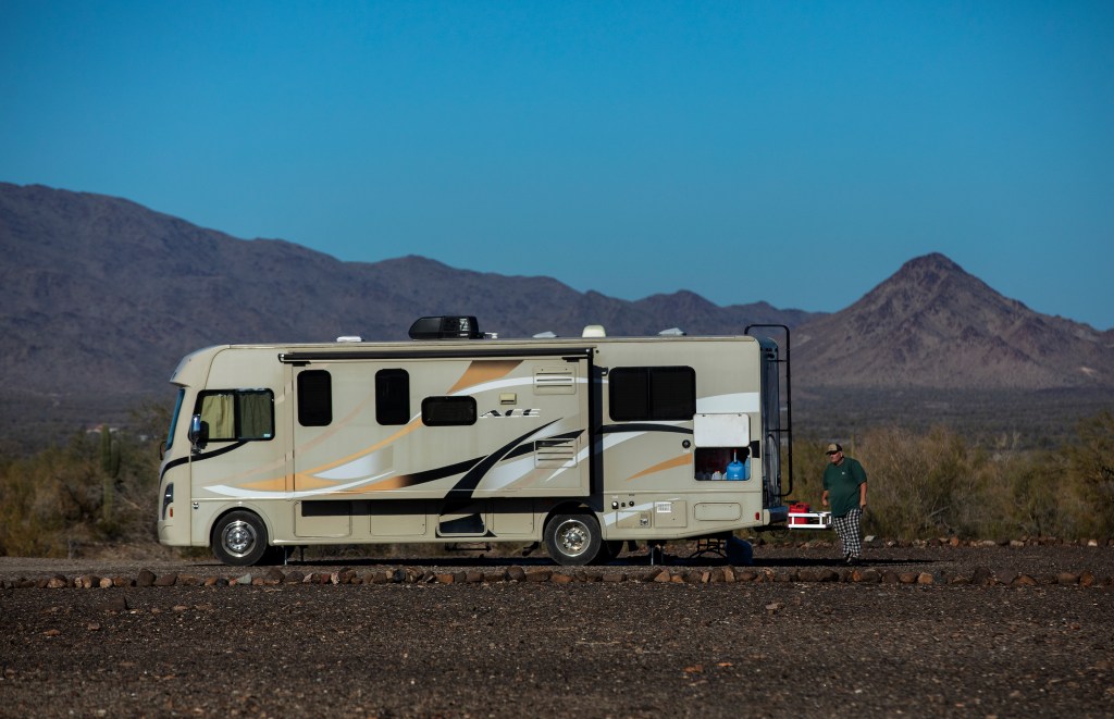 Class A RV Parked by Mountains