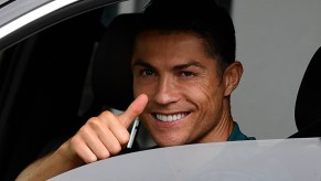 Soccer star Cristiano Ronaldo gives a thumbs-up in a car in May 2020 in Turin, Italy