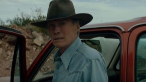 In Cry Macho, Clint Eastwood drives several vintage vehicles. Here he stands in front of his Chevrolet Suburban | Home Box Office, HBO's Youtube Channel