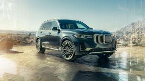 Dark blue 2022 BMW X7 parked on a desert landscape
