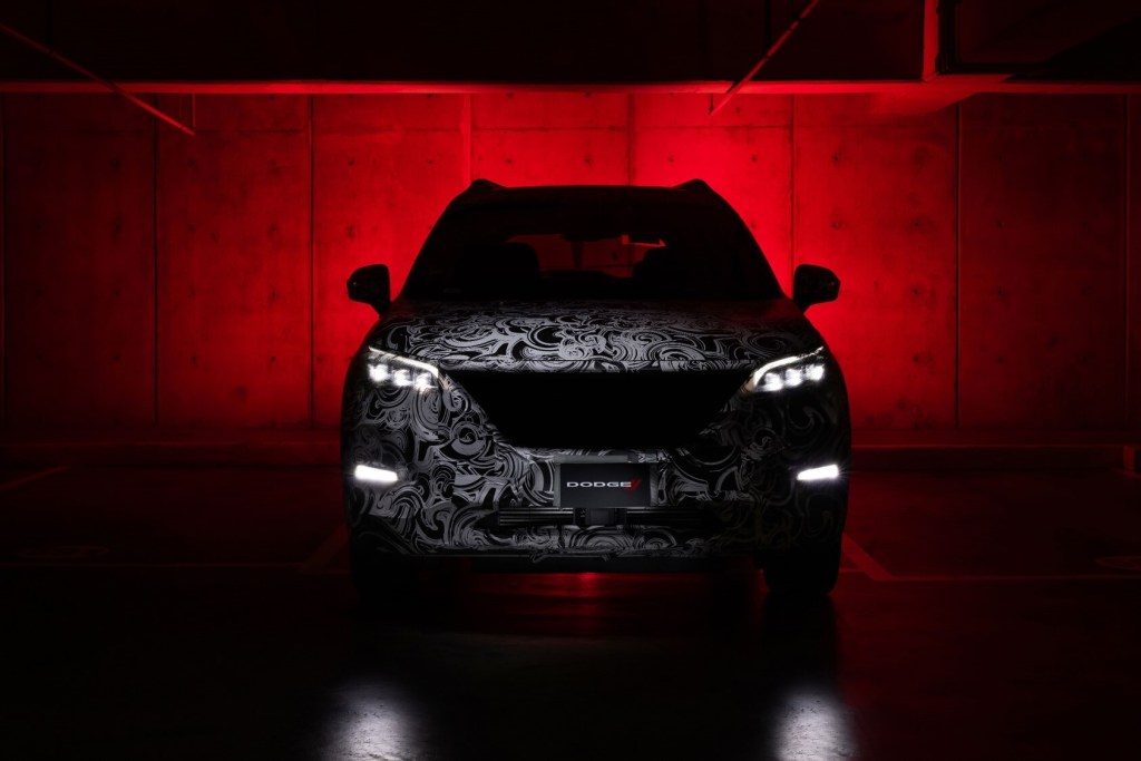 New Dodge SUV is teased in the dark, camouflaged.