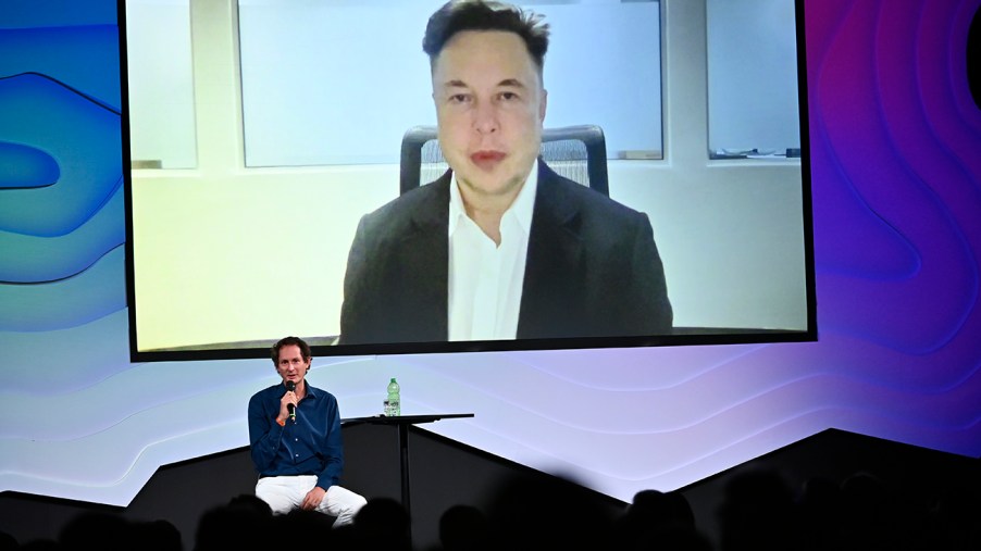 Elon Musk seen at Italian Tech Week discussing the global chip shortage