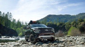 A black 2022 Ford Expedition Timberline driving through the mountains.