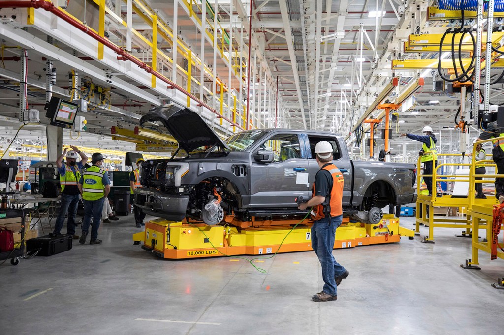 Ford F-150 Lightning being assembled in a factory.