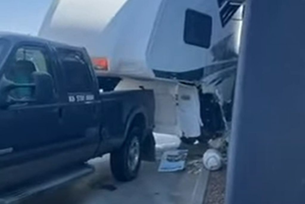 A Ford Super Duty towing a trailer through the drive through and nearly completely destroyed it. 
