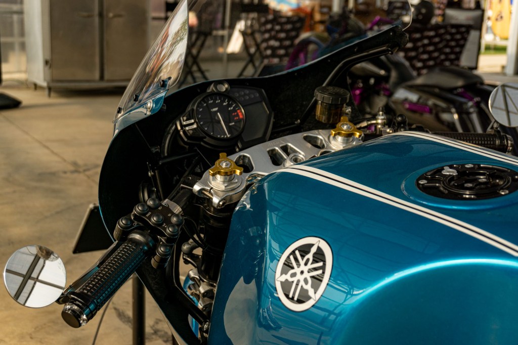 A closeup view of Robert Catanese's blue Framecrafters 2021 Yamaha YZF-R1 R1X's handlebars and gauges