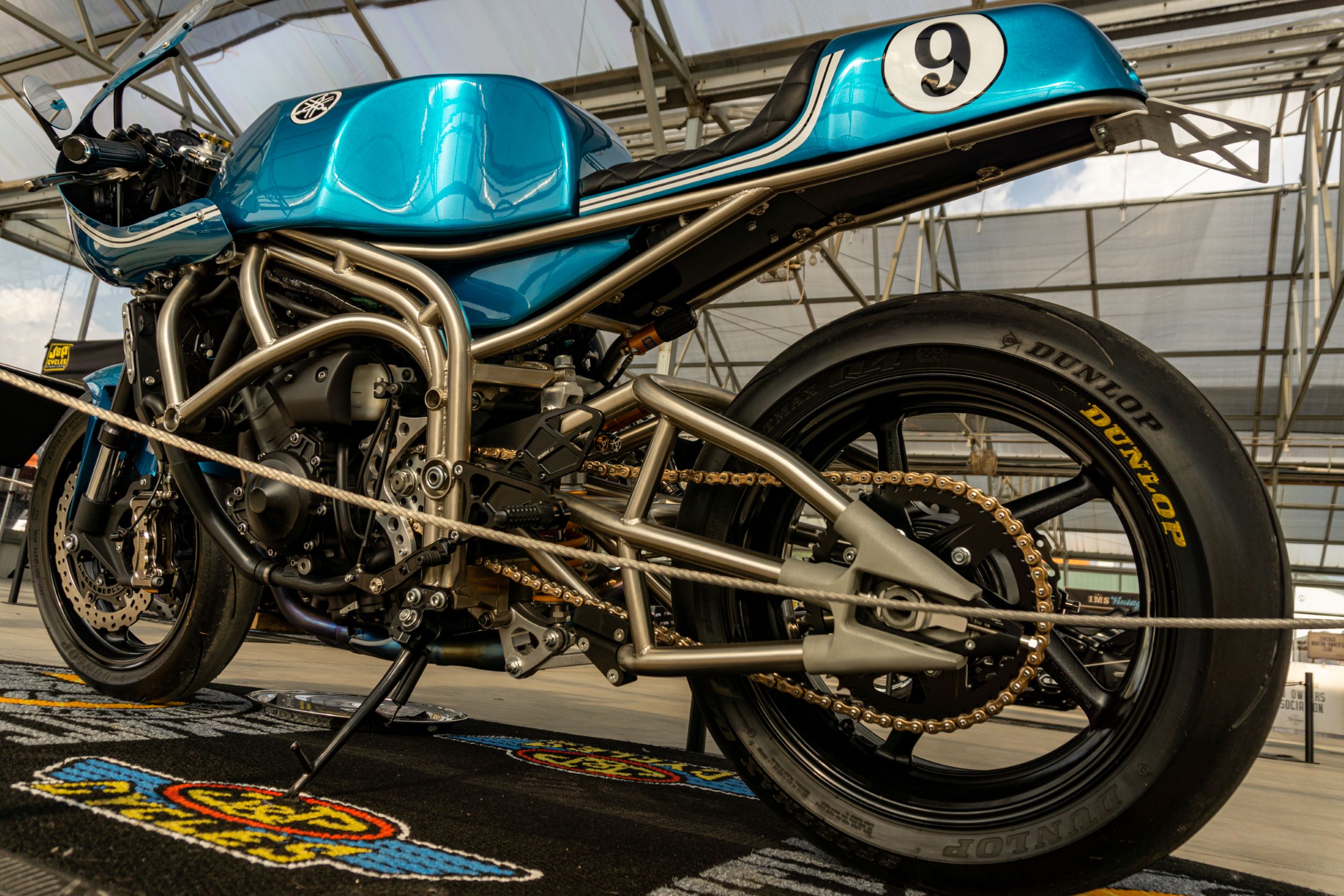 A low-angle rear 3/4 view of Robert Catanese's blue Framecrafters 2021 Yamaha YZF-R1 R1X
