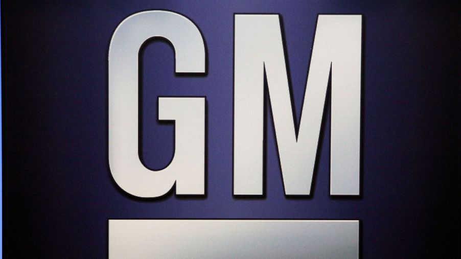 A white GM logo against a blue background.