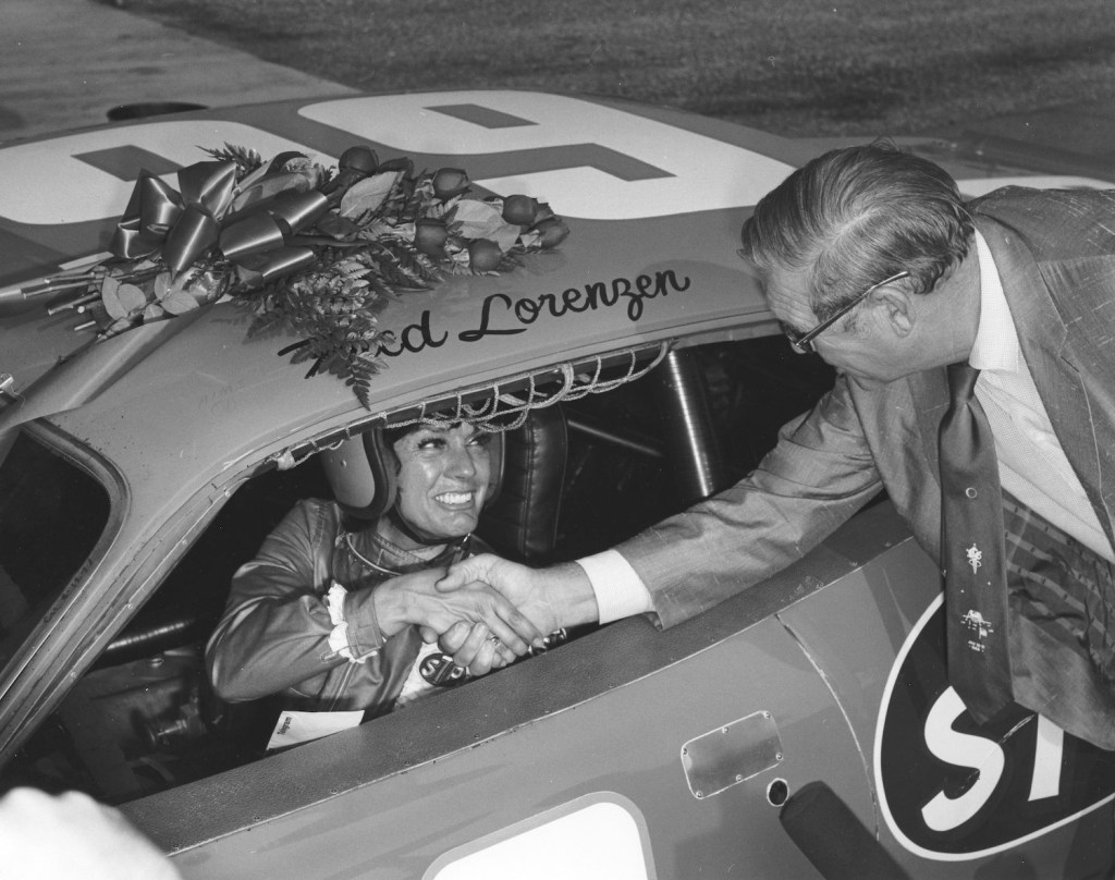 Paula Murphy and NASCAR President Bill France, Sr. before her record-setting Talladega run. Talladega Superspeedway is NASCAR's fastest track | Photo by ISC Images & Archives via Getty Images
