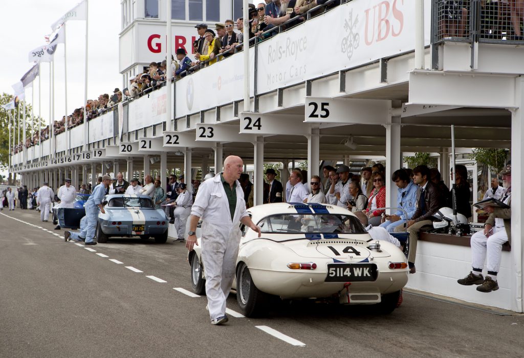 CHICHESTER, ENGLAND - SEPT 8th: View of the Pit Lane showing a1963 Jaguar E-type 'lightweight' driven by Gary Pearson/Emanuele Pirro in the RAC TT Celebration race at the 20th anniversary of the Goodwood Revival at Goodwood on September 8th 2018 in Chichester, England. (Photo by Michael Cole/Getty Images)"n find out the Goodwood Revival schedule and whether you have to dress up for the Goodwood Revival.