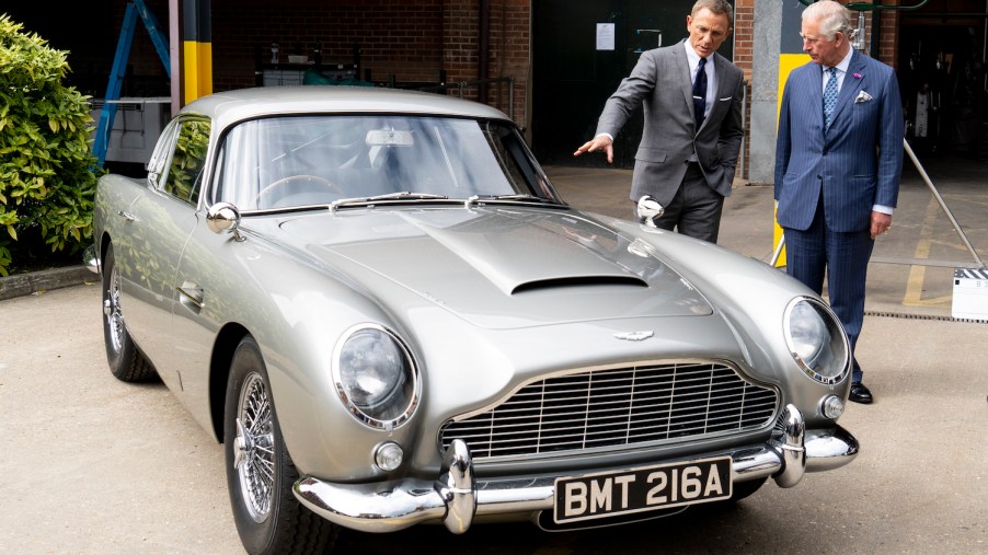 Daniel Craig and Prince Charles discussing James Bond's classic cars