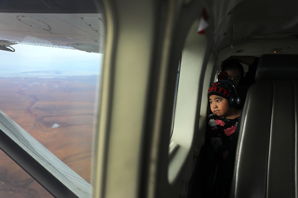 Ariel Hawley, 8, flying away from her hometown of Kivalina, Alaska. Planes are one of the only ways to access Kivalina. Alaska has the highest rate of deadly plane crashes in the country. | Joe Raedle/Getty Images