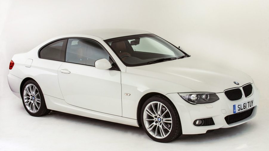 A white 2011 BMW 335i coupe is a hell of a luxury car, seen here in white shot from the front 3/4 view