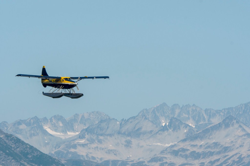 A floatplane flying over Lake Crescent in Lake Clark National Park and Preserve, Alaska, USA. Alaska has the highest rate of deadly plane crashes in the country. | Wolfgang Kaehler/LightRocket via Getty Images