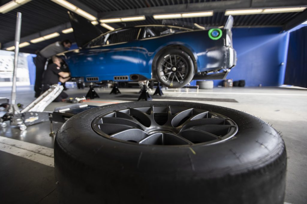 DAYTONA BEACH, FLORIDA - DECEMBER 15: The NASCAR Next Gen car sits in the garage area during the NASCAR Cup Series test at Daytona International Speedway on December 15, 2020 in Daytona Beach, Florida. (Photo by James Gilbert/Getty Images). See the Next Gen car's mono lug and centerlock wheel.