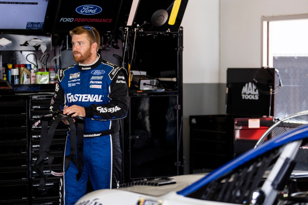 Chris Buescher, Driver of the #17 NASCAR Next Gen car, looks on in the garage during the NASCAR Cup Series test at Daytona International Speedway on September 07, 2021 in Daytona Beach, Florida. The NASCAR Next Gen rearview camera is highlighting a generational divide between Buescher and older drivers | James Gilbert/Getty Images