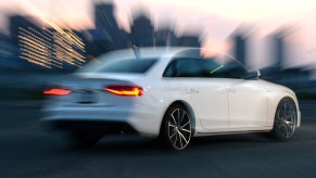 A white 2018 Audi S4 blurred out as it slides across the tarmac