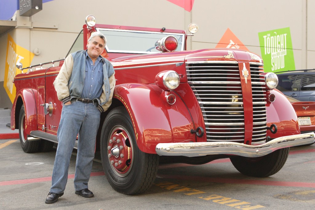 THE TONIGHT SHOW WITH JAY LENO -- Episode 3348 -- Pictured: Host Jay Leno drives away in one of his many "automobiles," a vintage collector red fire engine, after the show on April 16, 2007 -- Photo by: Paul Drinkwater/NBCU Photo Bank